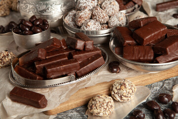 New Year's Eve table full of chocolates for children. Chocolate candy isolated 