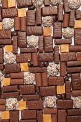 Assortment of delicious chocolate candies background. Chocolate candy isolated 