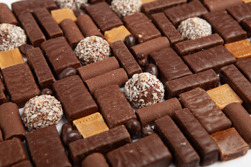 Assortment of delicious chocolate candies background. Chocolate candy isolated 