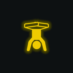 Boy Handstands With Legs Flexed yellow glowing neon icon