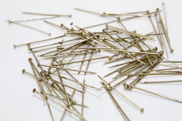 Metal pins with white background