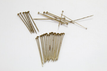 Metal pins with white background