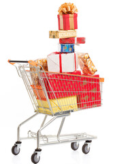 Pyramid of Christmas Gifts, Multicolored Boxes Fill a Shopping Cart on a White Background. Christmas Shopping Season. Close-up