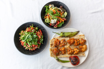 grilled chicken shish kebab with pepper and tomato