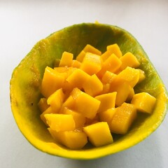 Ripe and fresh mango slices served on mango skin.