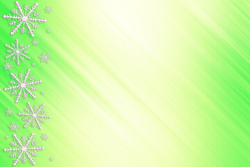 Winter yellow green mint saturated bright gradient background with random snowflakes sideways and with diagonal light stripes. Christmas, New Year card with copy space.