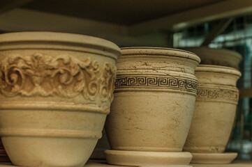 Fototapeta na wymiar Handmade pottery pots, raw handicraft clay brown tableware, ancient dishes