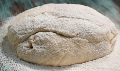 Fresh dough mixed and kneaded from white wheat flour before baking