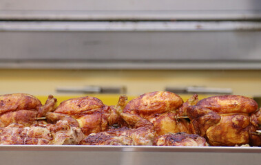 rotisserie van at the local market with employees
