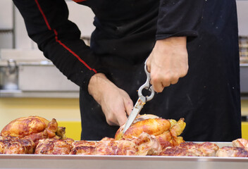 rotisserie van at the local market with employees