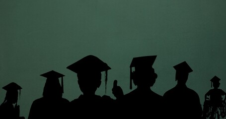 Silhouette male and female students wearing mortarboards against green background with copy space