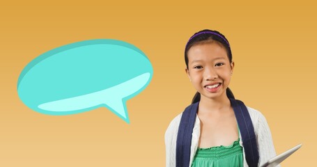 Digital composite of blank speech bubble with copy space by smiling schoolgirl