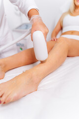 Laser epilation and cosmetology in beauty salon. Laser hair removal. Skin care. Woman legs during laser hair removal procedure.