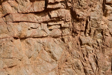 Fototapeta na wymiar the beautiful whimsical texture of the rock as a result of weathering. Stone background.