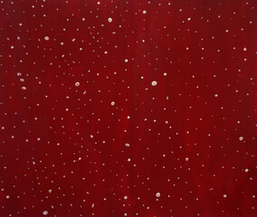 Christmas background. Burgundy background, falling snow. New Year