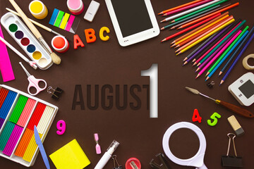August 1st . Day 1 of month, Calendar date. School notebook and various stationery with calendar day. School and office supplies frame. Summer month, day of the year concept.