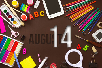 August 14th. Day 14 of month, Calendar date. School notebook and various stationery with calendar day. School and office supplies frame. Summer month, day of the year concept.