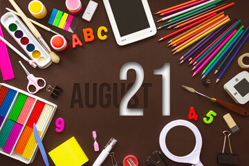 August 21st . Day 21 of month, Calendar date. School notebook and various stationery with calendar day. School and office supplies frame. Summer month, day of the year concept.