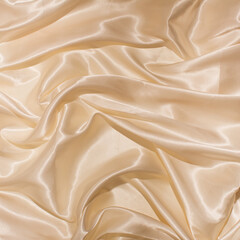 silk satin background. Shiny fabric with wavy folds. Beautiful fabric background . Flat lay.  Art concept