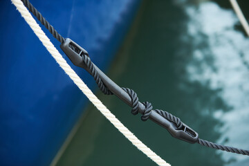 Mooring compensator of rope tension. Detail of boat.