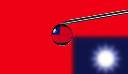 Vaccine syringe with drop on needle against national flag of Taiwan background. Medical concept vaccination. Coronavirus Sars-Cov-2 pandemic protection. National safety idea.