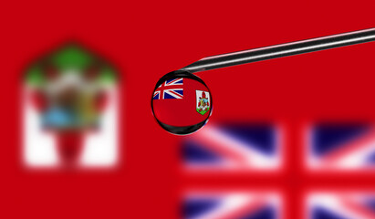 Vaccine syringe with drop on needle against national flag of Bermuda background. Medical concept vaccination. Coronavirus Sars-Cov-2 pandemic protection. National safety idea.