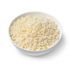 Bowl with fresh cut cauliflower rice isolated on white background