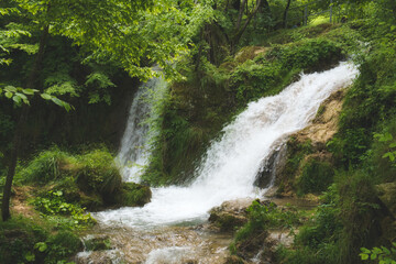 Fototapeta na wymiar Waterfall Gostilje falling from rock in Zlatibor resort of Serbia