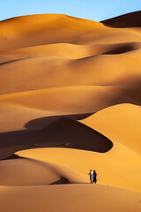 Fototapeta na wymiar lonley people in the desert of sahara