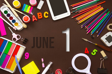 June 1st . Day 1 of month, Calendar date. School notebook and various stationery with calendar day. School and office supplies frame. Summer month, day of the year concept.