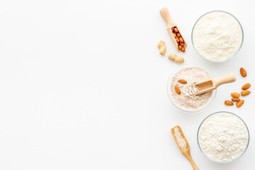 Fototapeta na wymiar Gluten free flour in bowls. Almond peanut oat and rice buckwheat flour in bowls