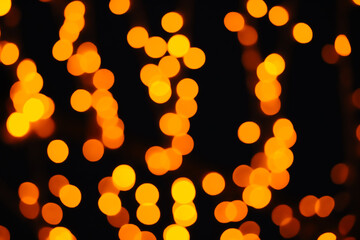 Blurred christmas background and bokeh defocus yellow light. Color fortuna gold.