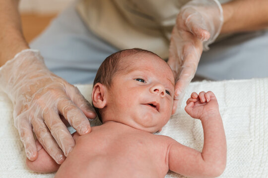 Close up view of a little baby receiving a treatment in a physiotherapy center.