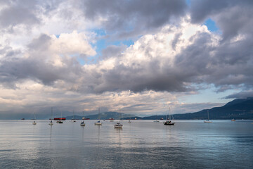 Calm morning on English Bay with mountains in the background