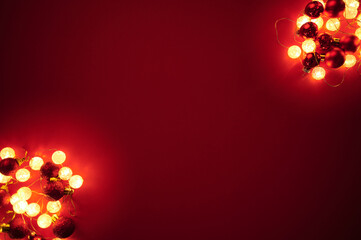 Christmas decoration card and illustration for Holliday red background with pinecones lights for corporate or personal invitations 