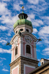 Fototapeta na wymiar The Spitalskirche or Hospital Church of the Holy Spirit, clock tower, Old Town, Innsbruck, Tyrol, Austria.