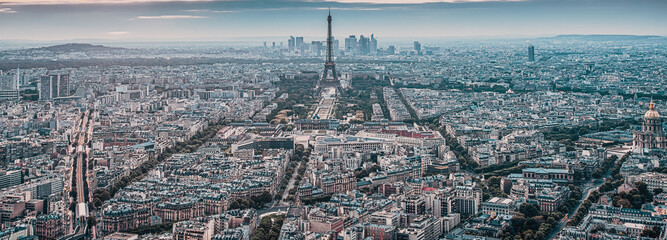 aerial view over Paris at sunset with iconic Eiffel tower
