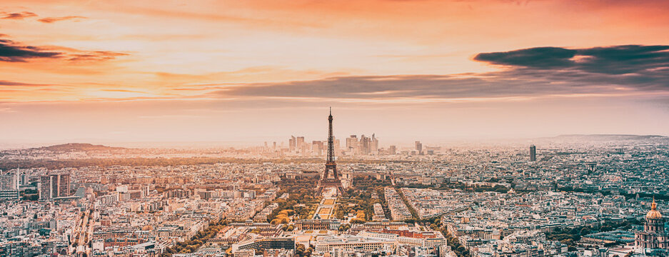 aerial view over Paris at sunset with iconic Eiffel tower
