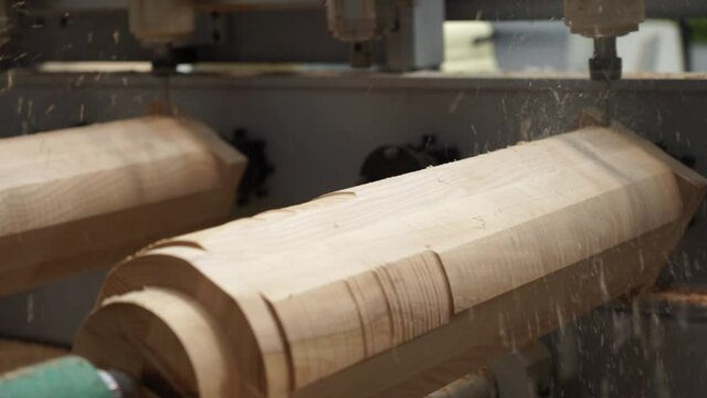 Multi-spindle milling machine manufactures decorative feet for furniture.