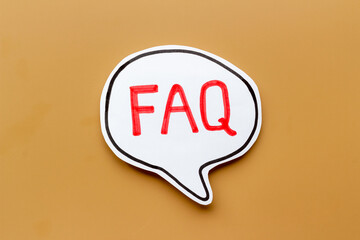 Faq - frequently asked questions - text on paper bubble, top view