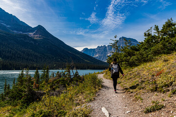 Female Hiker and Lake Josephine on The Grinnell Glacier Trail, Glacier National Park, Montana, USA