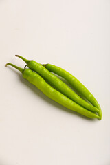 Fresh green chilli on white background.