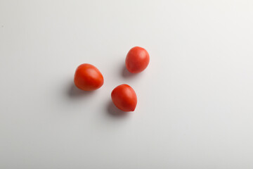 Fresh red tomato on white background.