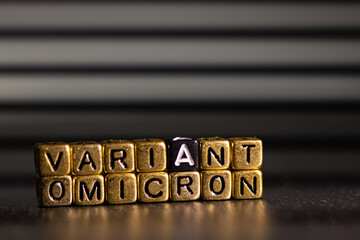 OMICRON Variant name reveal. SARS-CoV-2 Coronavirus Variant Omicron. Black background.