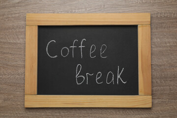 Blackboard with phrase Coffee Break on wooden table, top view