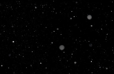 Light real snowfall in short exposure time against black background. Works well as an overlay. Horizontal alignment.