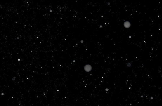 Light real snowfall in short exposure time against black background. Works well as an overlay. Horizontal alignment.