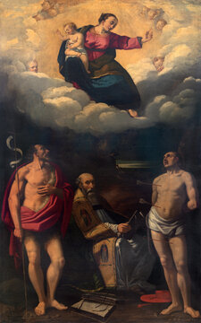 FERRARA, ITALY - NOVEMBER 9, 2021: The painting of Madonna with the St. John the Baptist, Sebastian and St. Bonaventure in the church Chiesa di San Francesco by Francesco Naselli (1630).