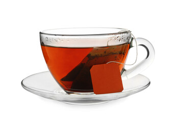 Tea bag in glass cup of hot water isolated on white