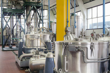 Stainless steel tank in chemical industry - factory indoor 
